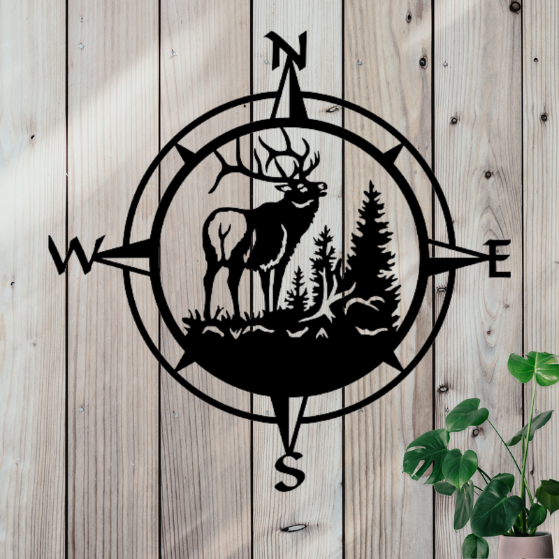 Compass decor with an elk in nature in the middle.