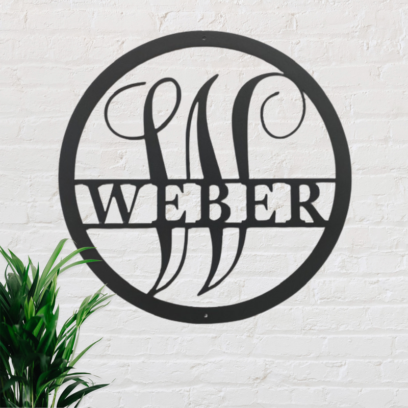 Circular metal sign with the name 'Weber' on a white brick wall.