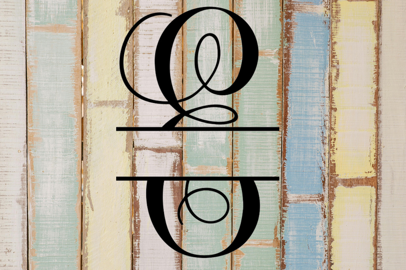 Decorative split letter monogram "E" on a rustic wooden background