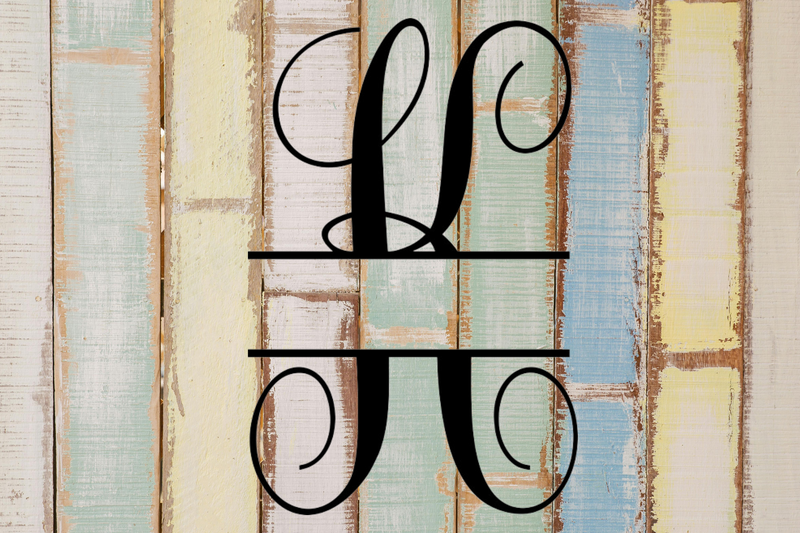 Decorative split letter monogram 'K' on a wooden background with a rustic finish.