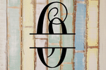 Decorative split letter monogram "O" on a textured wooden background