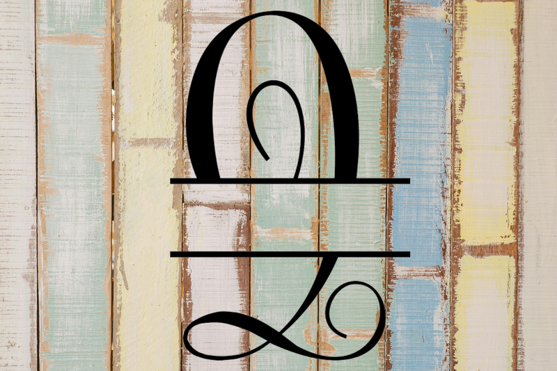Decorative split letter monogram 'Q' on a wooden background with vertical stripes in various colors.