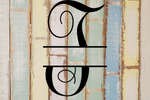 Decorative split letter monogram 'T' on a rustic wooden background with pastel colors.