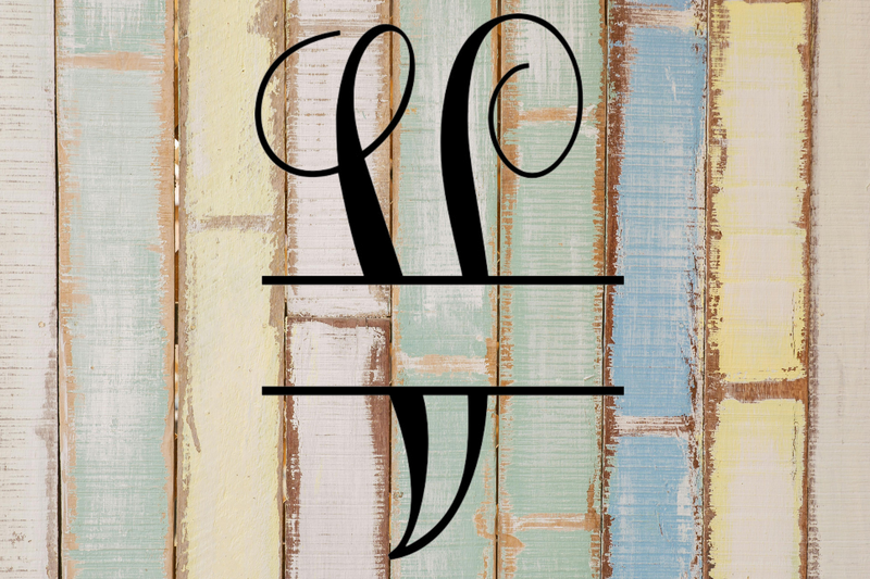 Decorative split letter monogram "V" on a rustic wooden background with pastel colours.