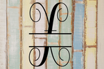 Decorative split letter monogram "X" on a rustic wooden background with a multicolor pattern.