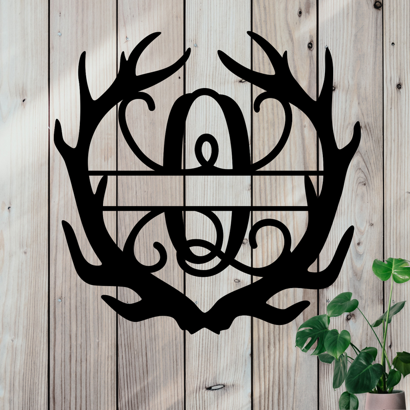 Metal sign in the shape of Antlers with a capital Q and a space for a custom name.