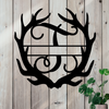Metal sign in the shape of Antlers with a capital T and a space for a custom name.