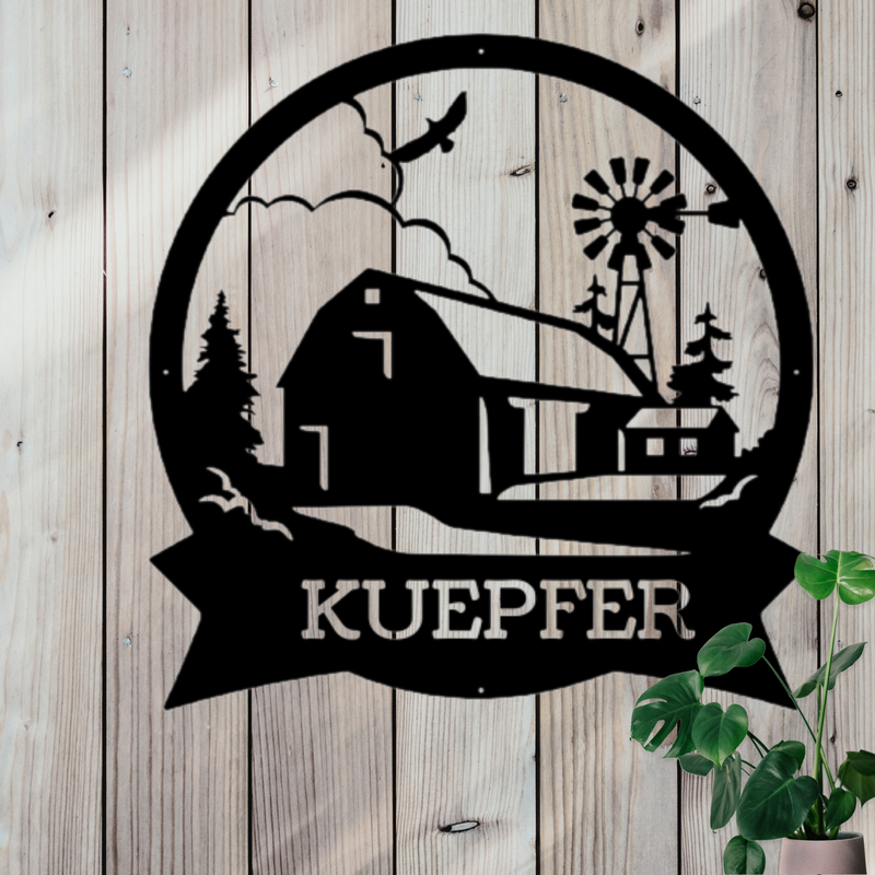 Round black metal sign with barn and windmill scene; and a place for a personalized name.