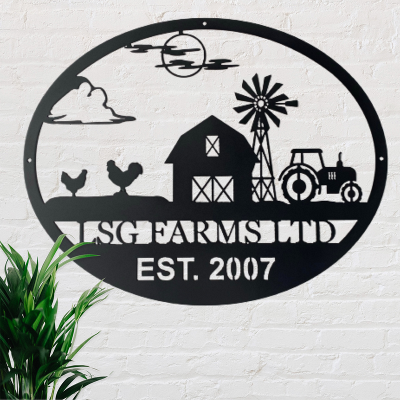 Monogram sign with a farm scene showing two chickens, a barn, tractor and windmill. 